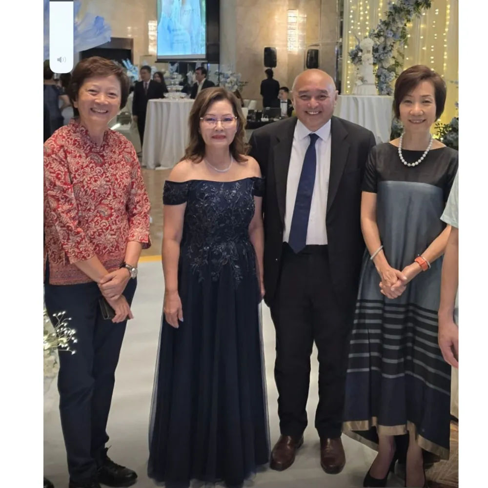MDM SHARON IN HER CUSTOM NAVY BLUE MOTHER-OF-THE-BRIDE GOWN FROM K GOWN, WITH FAMILY AT THE WEDDING RECEPTION