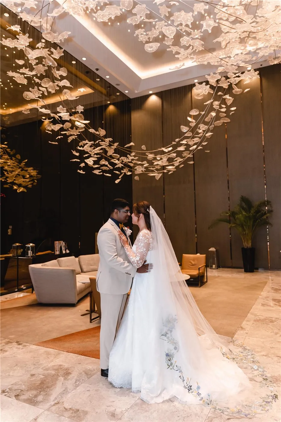 BRIDE AND GROOM AT THEIR SOFITEL SINGAPORE WEDDING, GOWN BY K GOWN